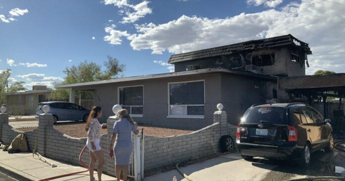10 people displaced after fire spreads between 2 Las Vegas